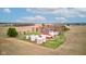 Breathtaking aerial view of a sprawling countryside property with a classic red barn and silos surrounded by farmland at 10573 W 550 N, Thorntown, IN 46071
