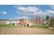 Scenic aerial view of a countryside farm featuring a red barn, silos, and farmhouse surrounded by farmland at 10573 W 550 N, Thorntown, IN 46071