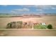 Expansive aerial shot of a countryside property featuring a barn, silos, and serene farmland at 10573 W 550 N, Thorntown, IN 46071
