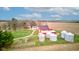 Picturesque aerial view of a charming red barn with adjacent silos on a beautiful rural property at 10573 W 550 N, Thorntown, IN 46071