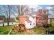 Aerial of the backyard with a brick house, a small deck and a flowering tree at 10573 W 550 N, Thorntown, IN 46071