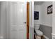 Cozy bathroom with wood grain floors, wainscotting and a newer toilet at 10573 W 550 N, Thorntown, IN 46071