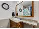 Bright bathroom featuring a vanity with decorative pulls, a large mirror, and a neutral color scheme at 10573 W 550 N, Thorntown, IN 46071