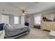 Comfortable bedroom with neutral walls, soft carpet, dresser, and two windows offering natural light at 10573 W 550 N, Thorntown, IN 46071