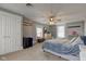 Spacious bedroom with neutral walls, carpeted floor, ample closet space, and a ceiling fan at 10573 W 550 N, Thorntown, IN 46071