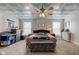 A well-lit bedroom with two windows, ceiling fan and well-appointed furnishings at 10573 W 550 N, Thorntown, IN 46071