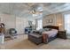 The bedroom has a ceiling fan, natural light, and neutral paint with comfortable furnishings at 10573 W 550 N, Thorntown, IN 46071