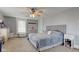 Bright bedroom featuring a cozy bed, neutral walls, carpet, and natural light from the window at 10573 W 550 N, Thorntown, IN 46071