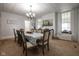 Elegant dining room with a long table set for a meal and natural light from the window at 10573 W 550 N, Thorntown, IN 46071