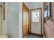 Entryway with closet and a red brick wall at 10573 W 550 N, Thorntown, IN 46071