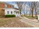 Side exterior featuring walkway, porch and mature trees at 10573 W 550 N, Thorntown, IN 46071
