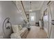 Inviting hallway showcasing carpeted stairs, a seating area with pillows, and decorative touches at 10573 W 550 N, Thorntown, IN 46071