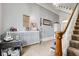 Hallway featuring carpeted stairs, white trim, decorative accents, and neutral walls at 10573 W 550 N, Thorntown, IN 46071