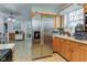 Bright kitchen featuring stainless steel appliances, light wood cabinets, and modern decorative tin-style ceiling at 10573 W 550 N, Thorntown, IN 46071