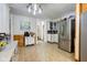 Spacious kitchen with stainless steel refrigerator, white accent furniture, and decorative tin style ceiling at 10573 W 550 N, Thorntown, IN 46071
