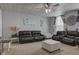 Spacious living room with comfortable seating, ottoman, and decorative ceiling tiles at 10573 W 550 N, Thorntown, IN 46071