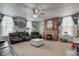 Inviting living room with a brick fireplace, ceiling fan, and comfortable seating at 10573 W 550 N, Thorntown, IN 46071