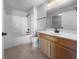 Bathroom featuring a tub, shower, single sink vanity, and a large mirror at 13381 N White Cloud Ct, Camby, IN 46113