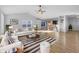 Bright living room with vaulted ceilings, wood floors, comfortable seating, and ample natural light at 13381 N White Cloud Ct, Camby, IN 46113