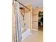 Bathroom featuring a bathtub, shower with rainfall shower head, and direct access to a walk-in closet at 1426 Ripplewood Dr, Danville, IN 46122