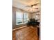 Neutral colored bedroom with a ceiling fan, natural light and paneled floors at 1426 Ripplewood Dr, Danville, IN 46122