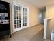 Bright hallway featuring a decorative glass door with lots of natural light coming into the home at 1426 Ripplewood Dr, Danville, IN 46122
