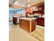 Kitchen featuring an island and seamless flow to the adjacent living area at 1426 Ripplewood Dr, Danville, IN 46122