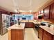 Inviting kitchen featuring an island, stainless appliances, and seamless flow to the living space at 1426 Ripplewood Dr, Danville, IN 46122