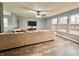 Cozy living room with a large sectional sofa, ceiling fan, and views of the outdoor deck at 1426 Ripplewood Dr, Danville, IN 46122