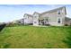 Sprawling backyard with lush green grass and a black metal fence at 15046 Sullivan Ln, Westfield, IN 46074