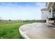 Wide shot of a backyard and concrete patio with a black metal fence at 15046 Sullivan Ln, Westfield, IN 46074