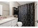 Neutral-toned bathroom with a shower and tub combo with decorative shower curtain at 15046 Sullivan Ln, Westfield, IN 46074