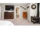 The main bedroom has neutral paint, carpet, two dressers, and a mounted TV at 15046 Sullivan Ln, Westfield, IN 46074