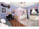 This bedroom features a four-poster bed, records as decor and lavender walls at 15046 Sullivan Ln, Westfield, IN 46074