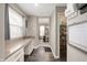 Convenient butler's pantry with ample counter space, storage cabinets, and a view into the dining room at 15046 Sullivan Ln, Westfield, IN 46074