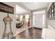 Welcoming foyer with hardwood floors, showcasing the dining room, staircase, and front door at 15046 Sullivan Ln, Westfield, IN 46074