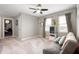 Carpeted loft area with a ceiling fan, a window seat and comfortable seating at 15046 Sullivan Ln, Westfield, IN 46074