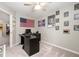 Home office with neutral walls, a ceiling fan and an American flag at 15046 Sullivan Ln, Westfield, IN 46074