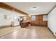 Spacious basement with wood paneled walls, wood-look flooring and a functional bar area at 1617 S N St, Elwood, IN 46036