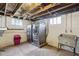 The laundry room features a front-load washer and dryer set and wash basin at 1617 S N St, Elwood, IN 46036
