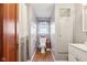 Bathroom featuring hardwood floors, toilet, and a window at 1617 S N St, Elwood, IN 46036