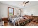 Cozy bedroom with a ceiling fan, two windows, and hardwood floors at 1617 S N St, Elwood, IN 46036