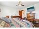 Bedroom featuring hardwood floors, a ceiling fan, and natural wood dressers at 1617 S N St, Elwood, IN 46036