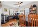 Dining room with hardwood floors, two windows, and a bookcase at 1617 S N St, Elwood, IN 46036