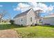 Back view of home, showcasing well-kept backyard with vinyl siding at 1617 S N St, Elwood, IN 46036