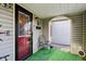 Inviting front porch with a comfortable chair and decorative accents at 1617 S N St, Elwood, IN 46036