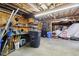 A spacious garage interior with wooden walls, shelving, and ample storage space at 1617 S N St, Elwood, IN 46036
