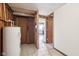 Hallway with access to a kitchen and showcasing the home's water heater at 1617 S N St, Elwood, IN 46036
