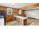 This kitchen has an eat-in bar and plenty of natural light from two windows at 1617 S N St, Elwood, IN 46036