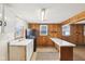 Rustic kitchen features a breakfast bar and window overlooking the outdoors at 1617 S N St, Elwood, IN 46036